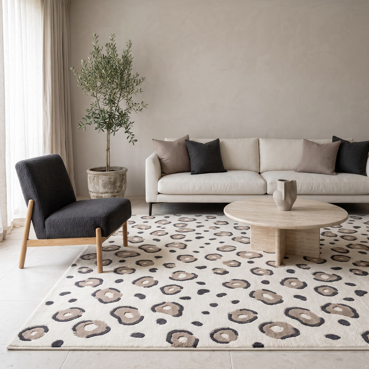 Ivory Leopard Rug with a cream wool surface, taupe and charcoal rosette spots, and a sculpted raised pattern