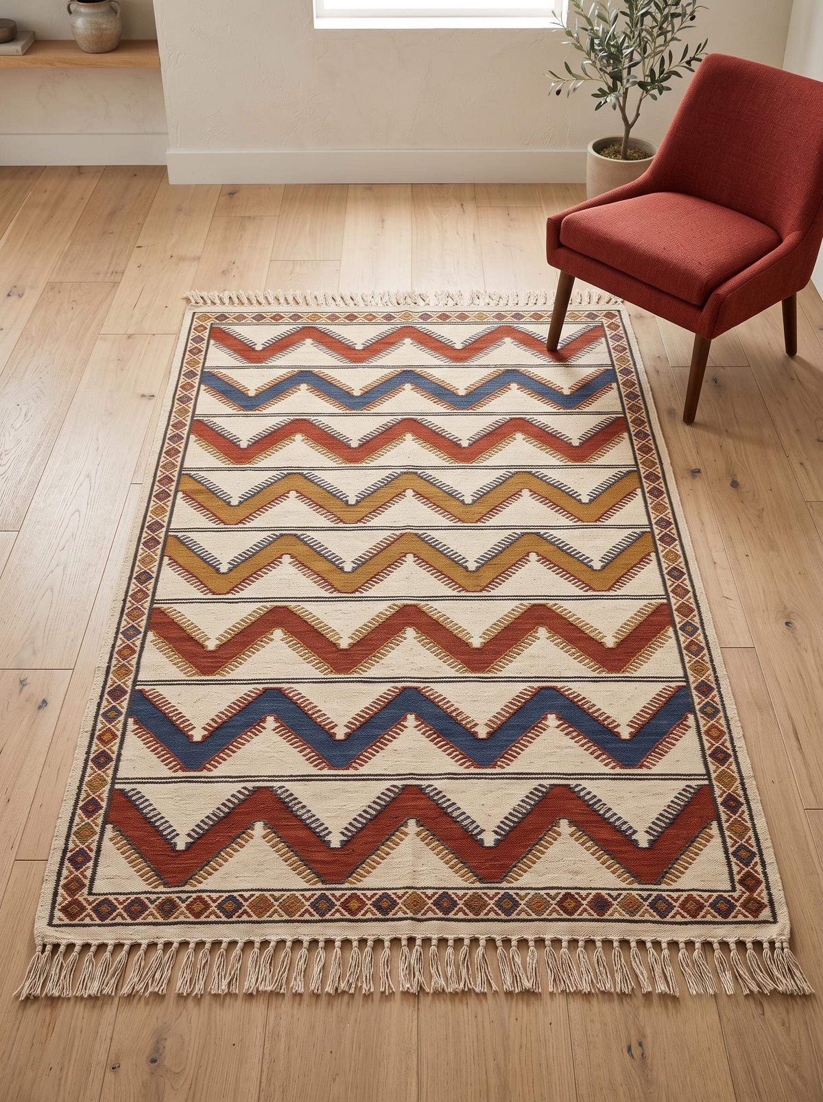 Handwoven ivory rust chevron kilim wool flatweave rug with diamond border and tassels