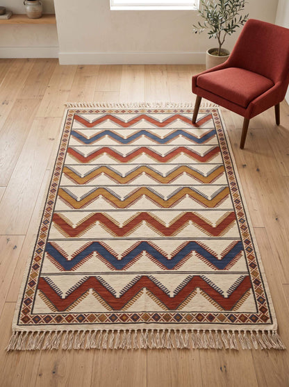 Handwoven ivory rust chevron kilim wool flatweave rug with diamond border and tassels