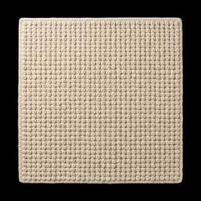 Ivory textured hand-woven wool rug with chunky bobble loop design for neutral living room decor