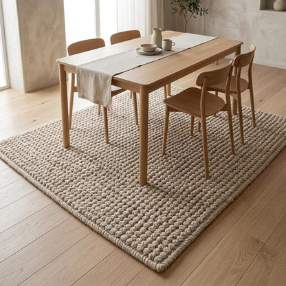 Ivory textured wool rug hand-woven with chunky bobble loops in neutral living room decor