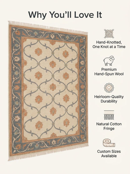 Ivory Trellis Rug with an ivory field, slate blue vine lattice, peach floral motifs, dark blue floral border and cotton fringe