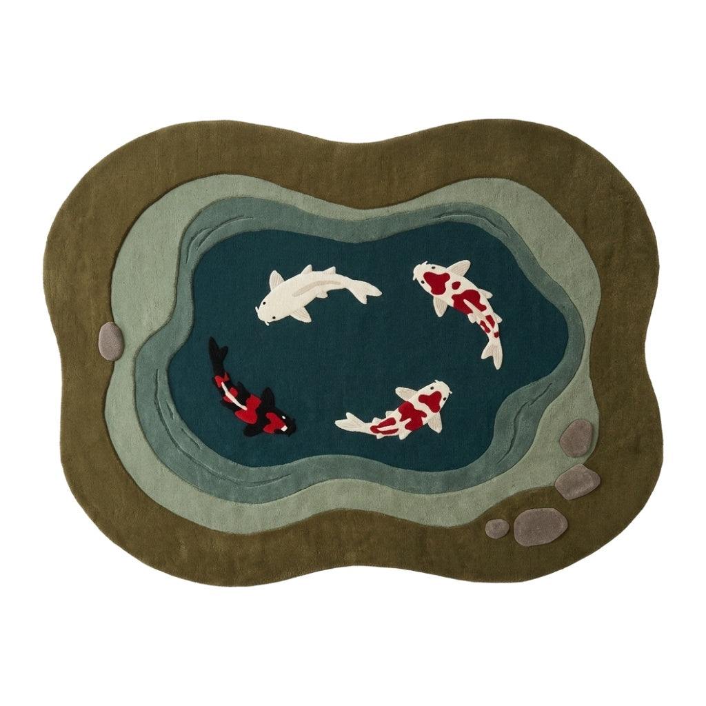 Koi Fish Garden Pond Rug in olive and teal wool, with layered grey-green stone bands, carved pebbles and four koi