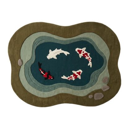 Koi Fish Garden Pond Rug in olive and teal wool, with layered grey-green stone bands, carved pebbles and four koi