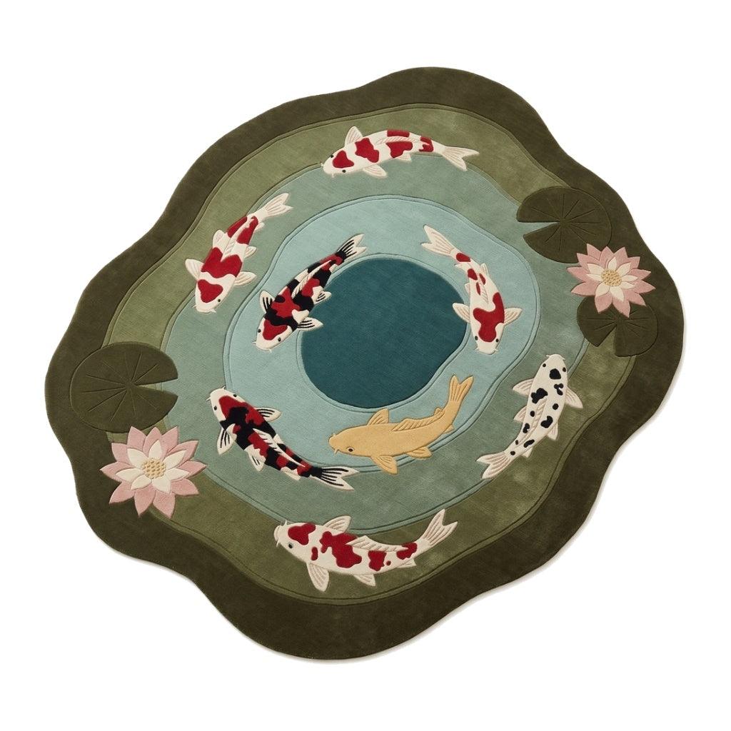 Koi Pond Lotus Rug in hand-tufted wool, featuring red, white, black and gold koi, pink lotus flowers and olive lily pads