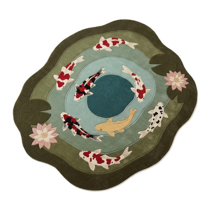 Koi Pond Lotus Rug in hand-tufted wool, featuring red, white, black and gold koi, pink lotus flowers and olive lily pads