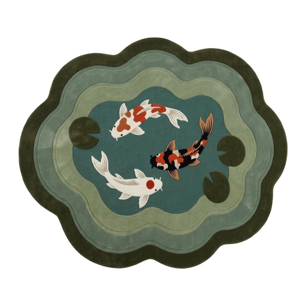 Koi Pond Rug in a cloud shape with three white, orange and black fish on teal, sage and olive concentric waves