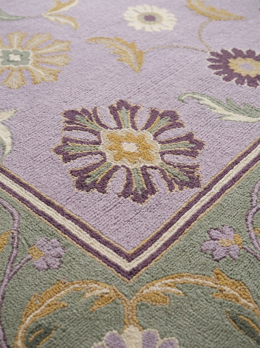 Lavender Floral Rug with a textured wool pile, golden and plum blossoms, and a sage green floral border