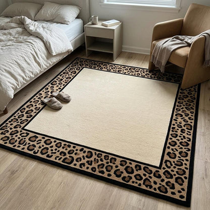Leopard Border Rug with a plain ivory centre and tan, caramel and black spotted border, framed by crisp black lines