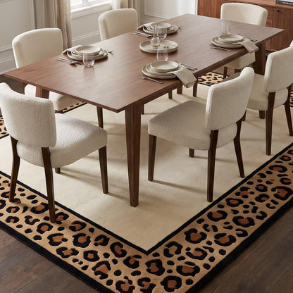 Leopard Border Rug with a plain ivory centre and wide tan, caramel and black leopard-print border with crisp black edging