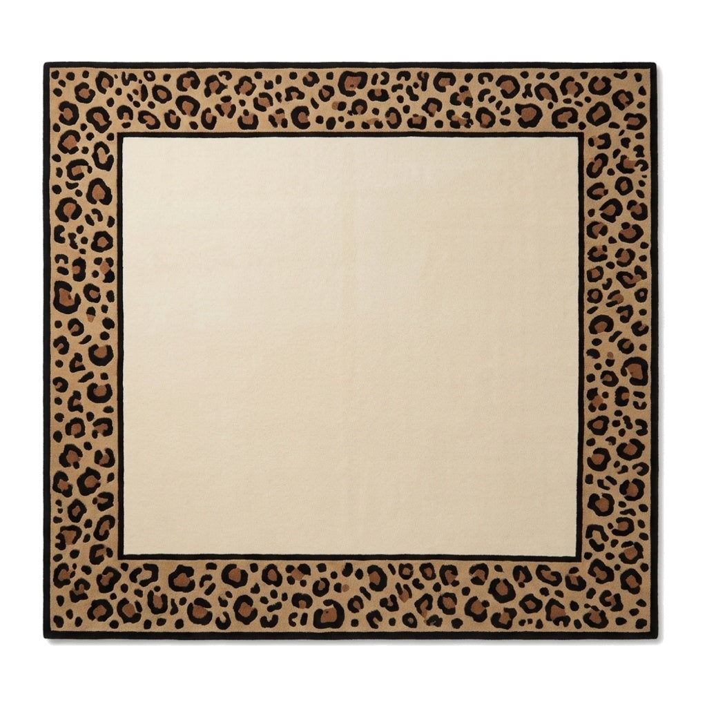Leopard Border Rug in ivory wool with a plain centre, tan and caramel leopard print border, and crisp black lines