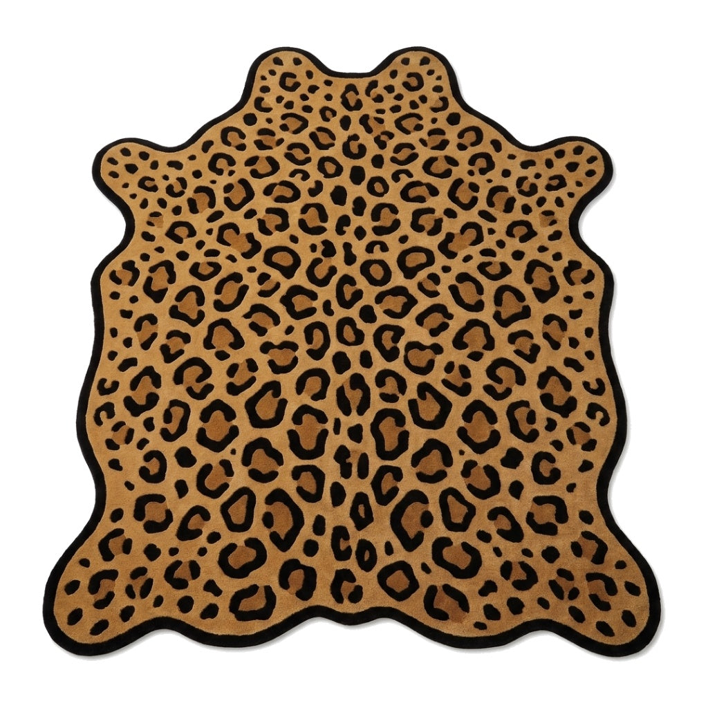 Leopard Hide Rug with golden tan and honey-brown ground, bold black rosette spots, and an irregular hide shape with black edging