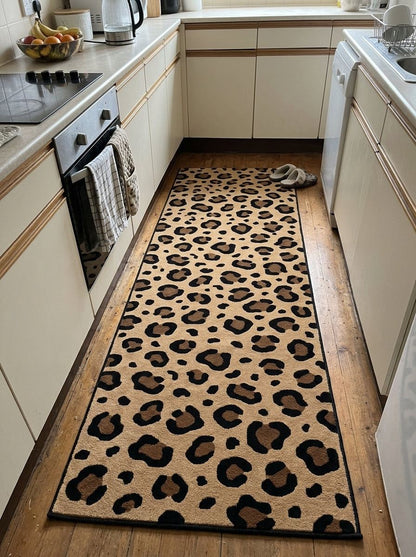 Leopard Print Runner Rug in tan with black and brown rosette spots, featuring a slim dark bound edge
