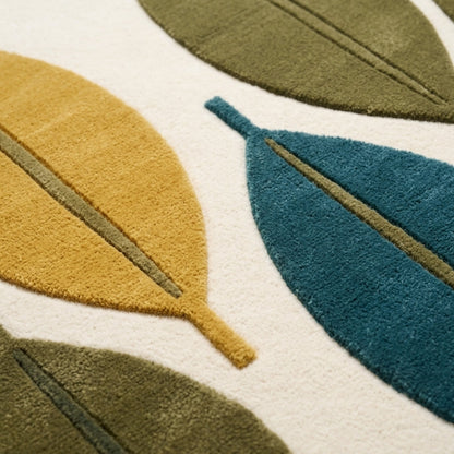 Mid Century Leaf Rug with plush wool leaves in teal, mustard and olive on ivory, featuring carved vein details