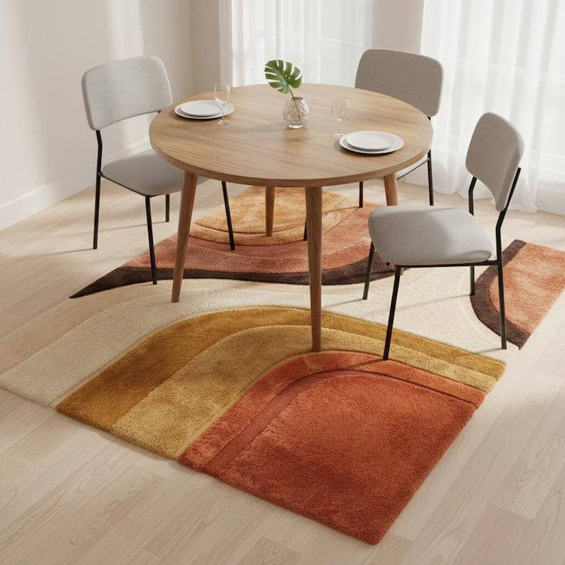 Mid Century Modern abstract hand-tufted area rug with terracotta, mustard, and cream geometric design
