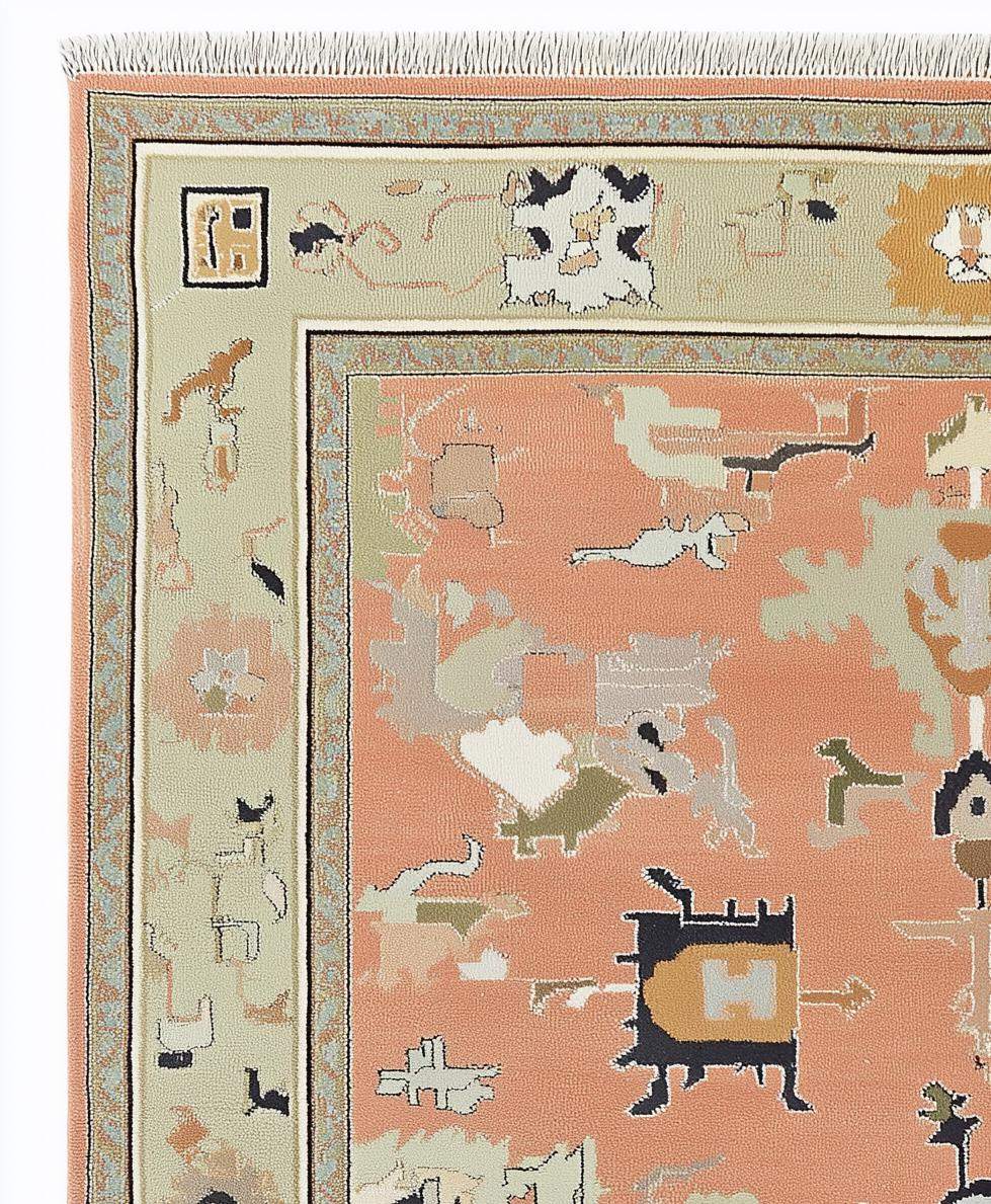 Modern abstract peach wool rug with geometric sage border and hand-knotted design