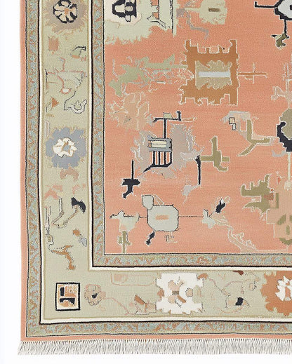 Modern abstract peach wool rug with geometric sage green border and hand-knotted design