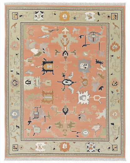 Modern abstract peach wool rug with geometric sage green border and hand-knotted design