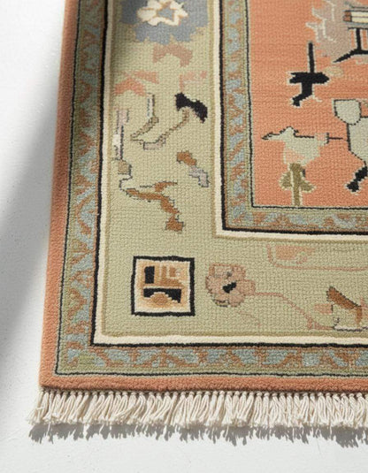 Modern abstract peach wool rug with hand-knotted geometric design and sage green border