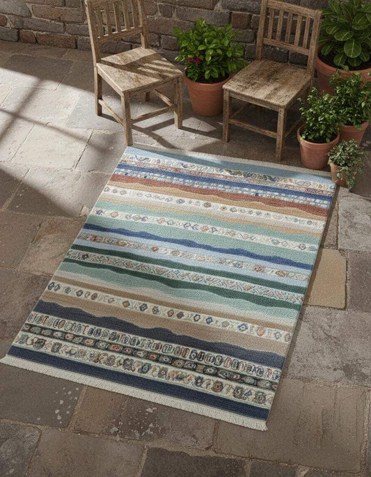 Multicolor striped area rug with boho coastal fringe design featuring horizontal bands in blue, teal, sage, sand, taupe, clay, and terracotta.