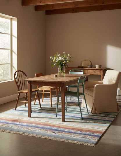 Multicolor striped area rug with boho coastal fringe design featuring horizontal solid and patterned bands in blue, teal, sage, sand, taupe, clay, and terracotta colors