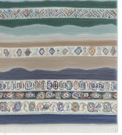 Multicolor striped area rug with horizontal boho coastal fringe design in blues, greens, terracotta, and taupe