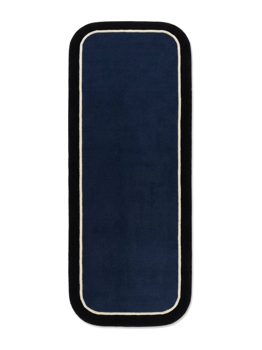 Navy Blue Border Runner Rug with a solid navy wool field, thin ivory pinline, wide black border and rounded ends