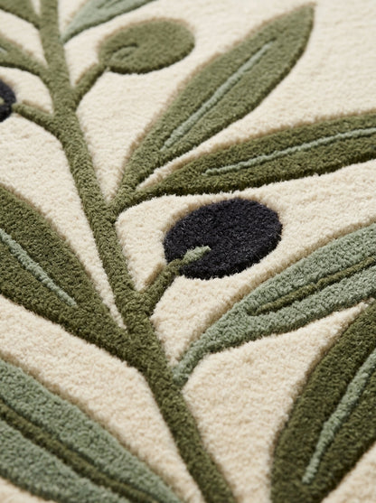 Olive Branch Runner Rug with a plush ivory wool surface, raised olive green leaves and dark charcoal olives in a botanical design