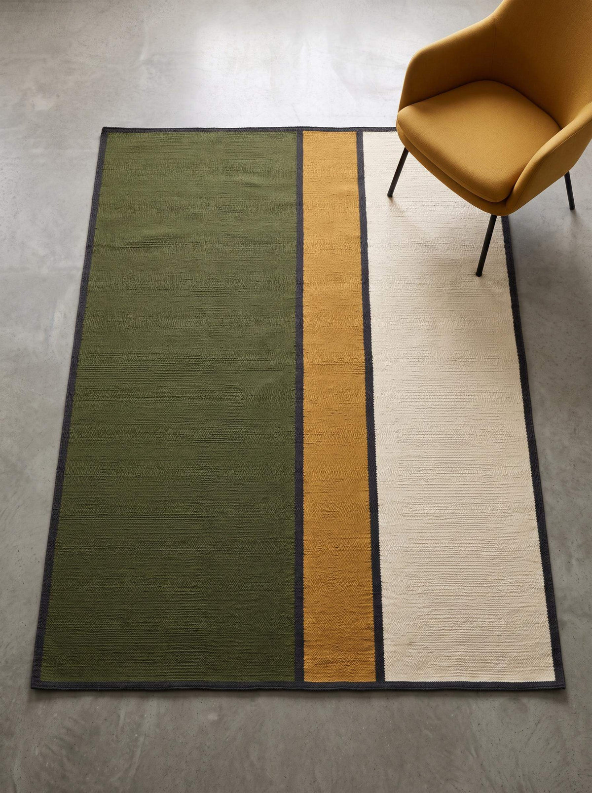 Olive green wool flatweave area rug with mustard and ivory color blocks and charcoal border