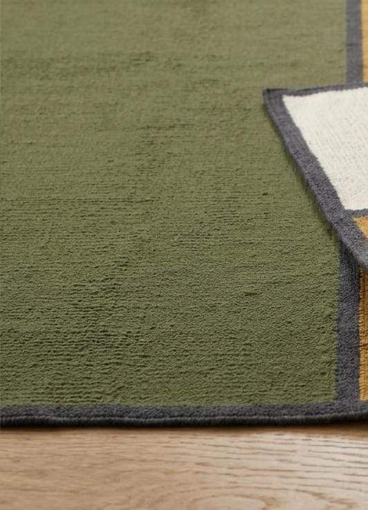 Olive green wool flatweave area rug with mustard and ivory color blocks and charcoal borders