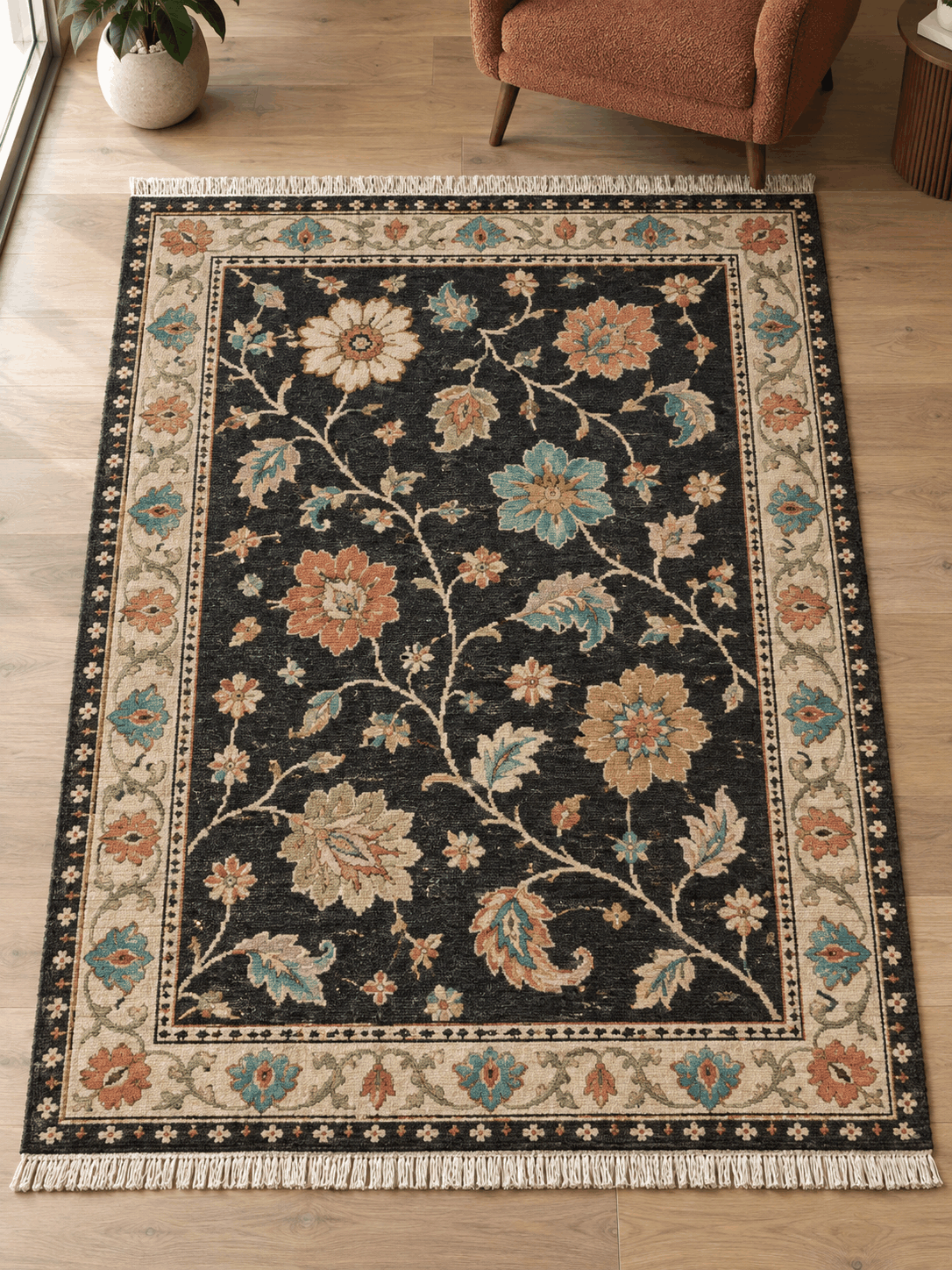 Oushak Hand Knotted Rug in charcoal wool with colorful floral vines, ivory palmette border, and fringed ends