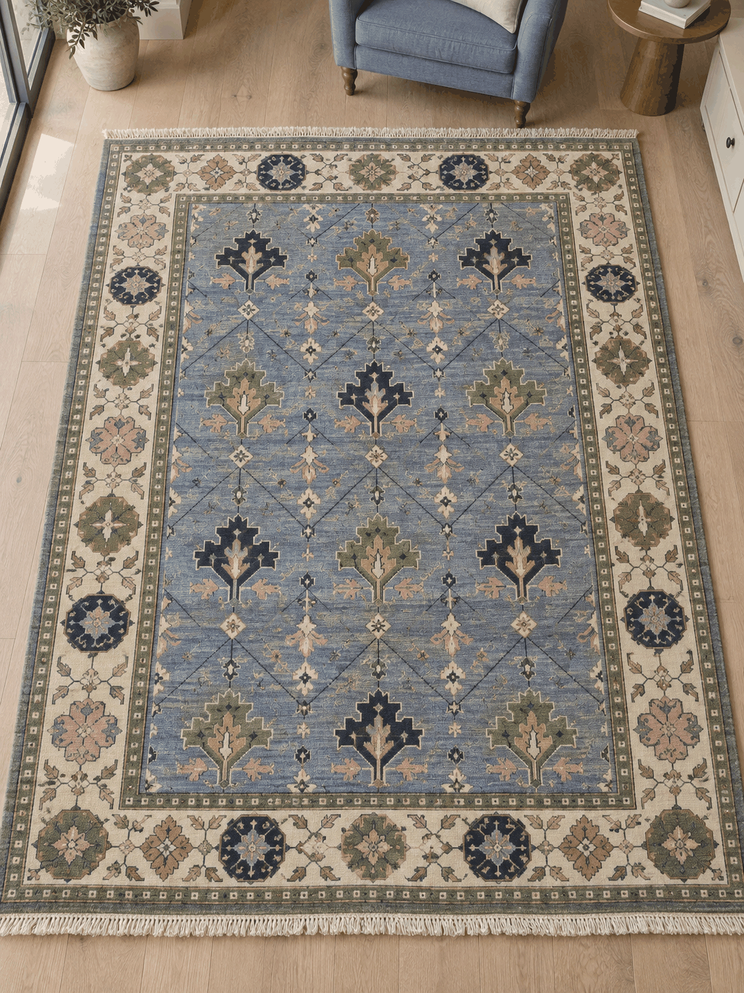 Oushak Hand Knotted Rug in cornflower blue wool, with stepped navy and sage tree motifs, diamond lattice and ivory floral border