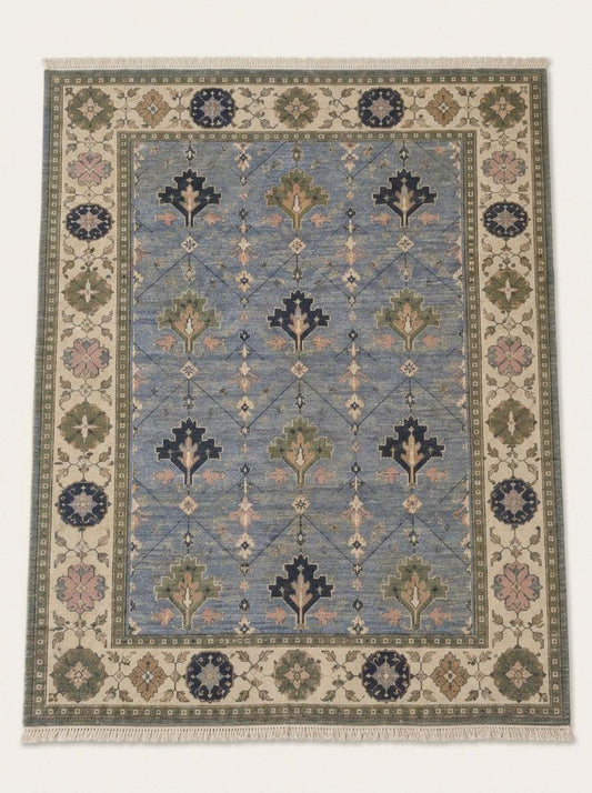 Oushak Hand Knotted Rug in cornflower blue wool with stepped tree motifs, diamond lattice and ivory floral border