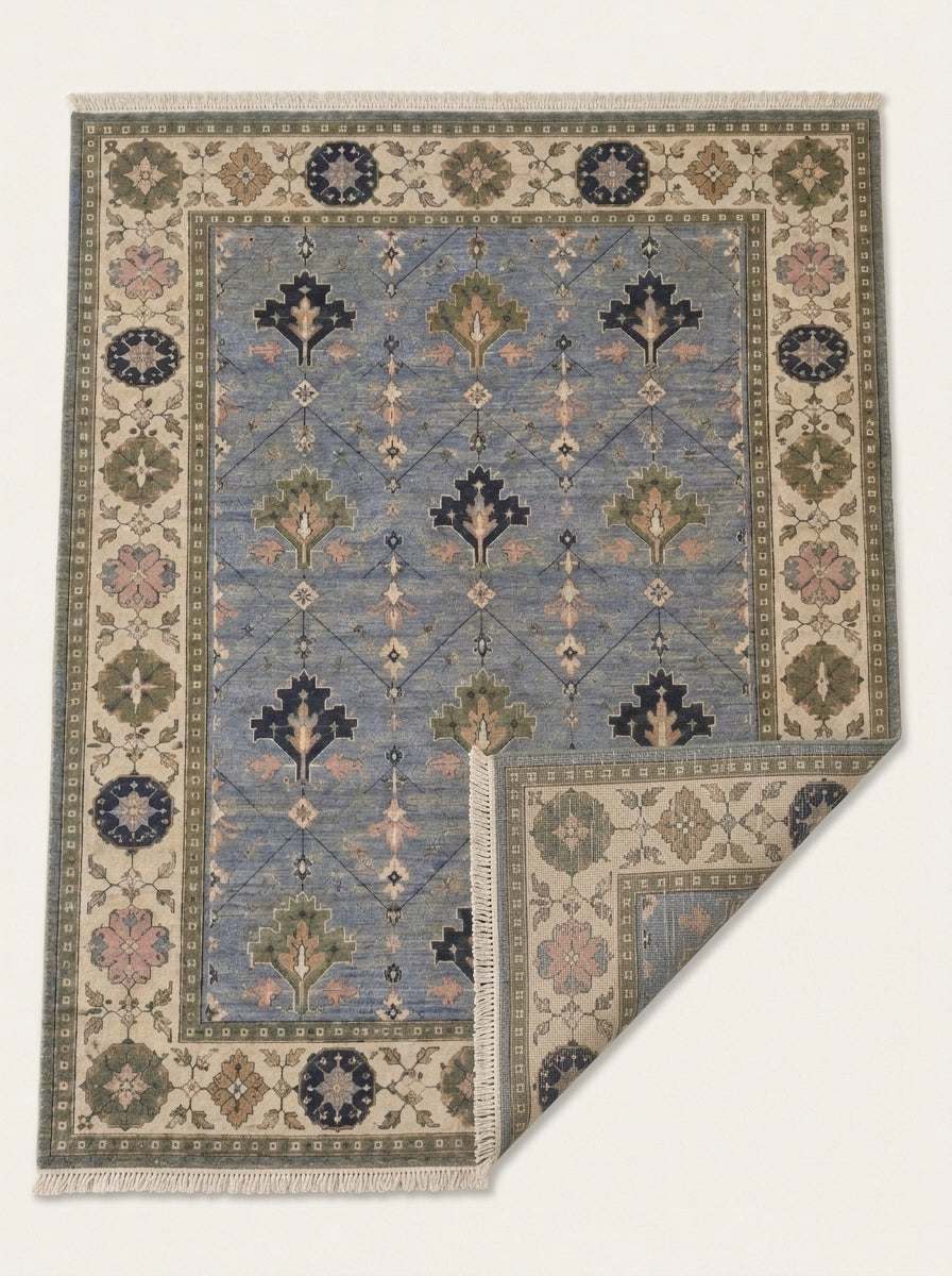 Oushak Hand Knotted Rug in cornflower blue wool, with stepped tree motifs, diamond lattice and ivory floral border