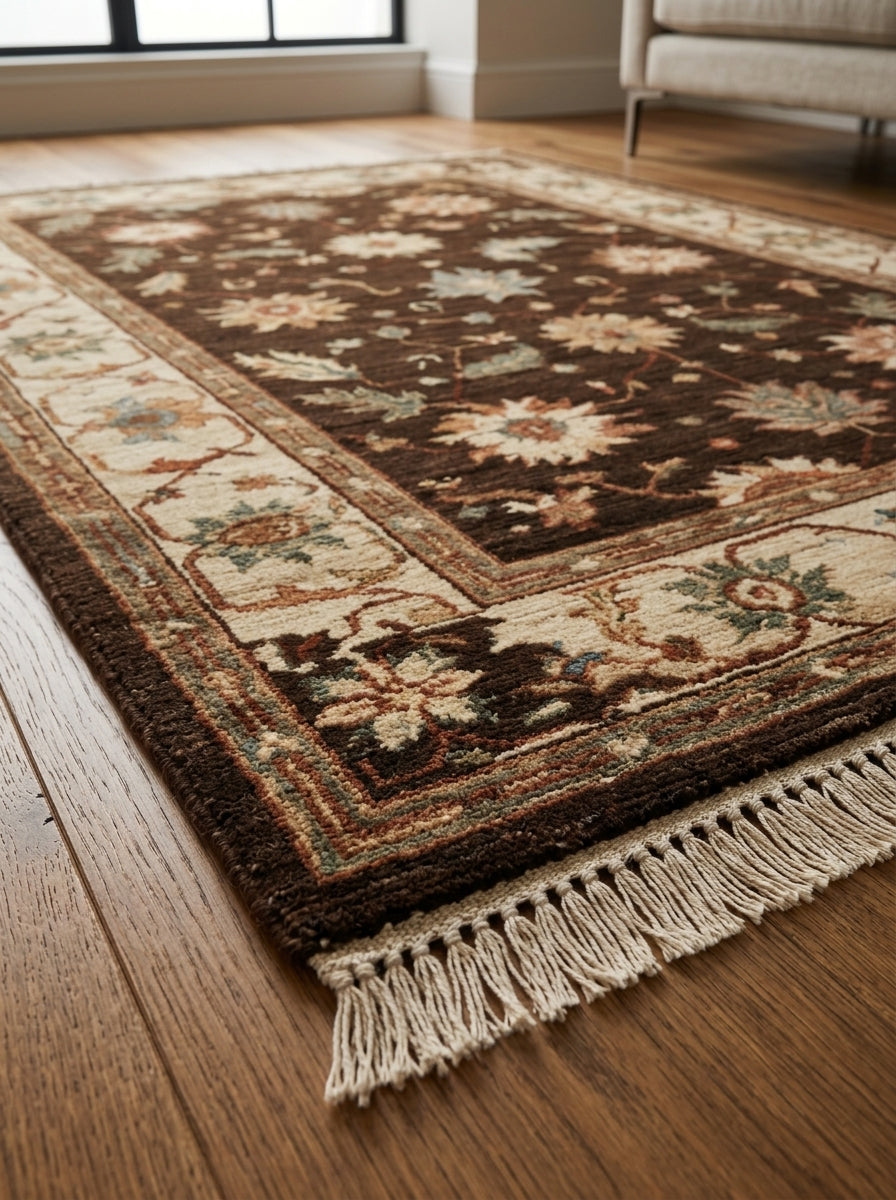 Oushak Hand Knotted Rug in espresso brown wool, with cream, rust and sage florals, beige scrolling border and fringe.