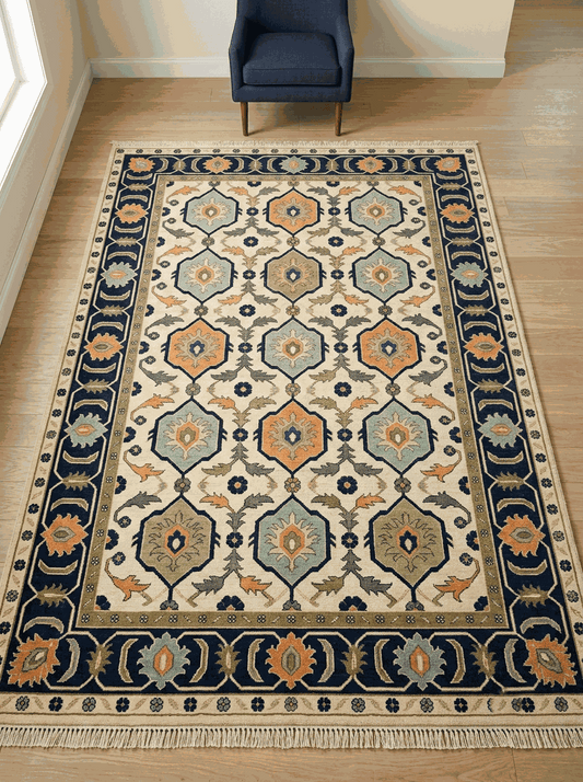 Oushak Hand Knotted Rug in ivory wool with navy-outlined hexagon medallions, aqua, orange and olive accents, and a navy floral border