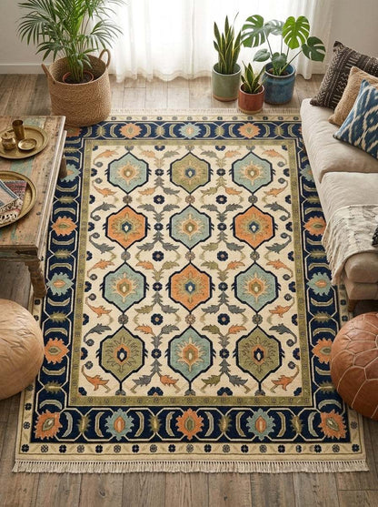 Oushak Hand Knotted Rug in ivory wool with navy-outlined hexagon medallions in aqua, orange and olive