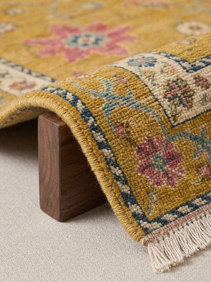 Oushak Hand Knotted Rug in mustard wool with multicolour floral motifs, ivory rosette border and fringed edge