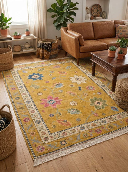 Oushak Hand Knotted Rug in mustard yellow wool with multicolour floral motifs, ivory rosette border and fringed ends