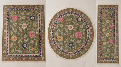 Oushak Hand Knotted Rug in olive green wool, with folk floral vines, perched birds and a striped pink and navy border