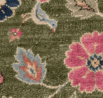 Oushak Hand Knotted Rug in olive green wool, with textured pile, pink and navy flowers, blue leaves and ivory vines