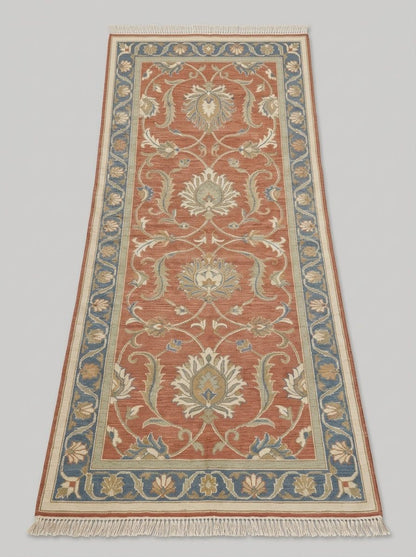 Hand Knotted Oushak Runner Rug in terracotta wool with ivory floral vines, muted blue borders, and fringe.