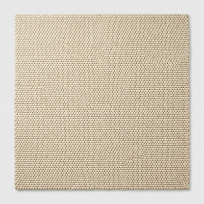Chunky Wool Rug in natural sand beige, with a dense, raised loop-woven texture and clean rectangular shape.