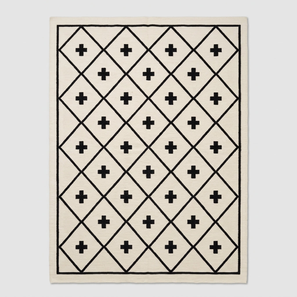Southwestern Flatweave Wool Rug in ivory with a black diamond lattice, Swiss cross motifs, and slim border.