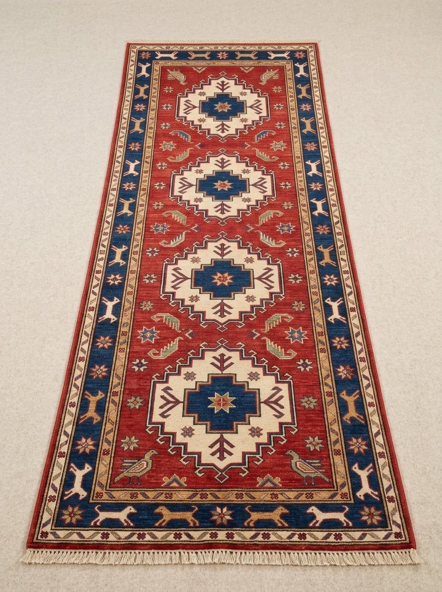 Hand Knotted Oushak Runner Rug in red wool with ivory medallions, navy star centers, animal border, and fringe.
