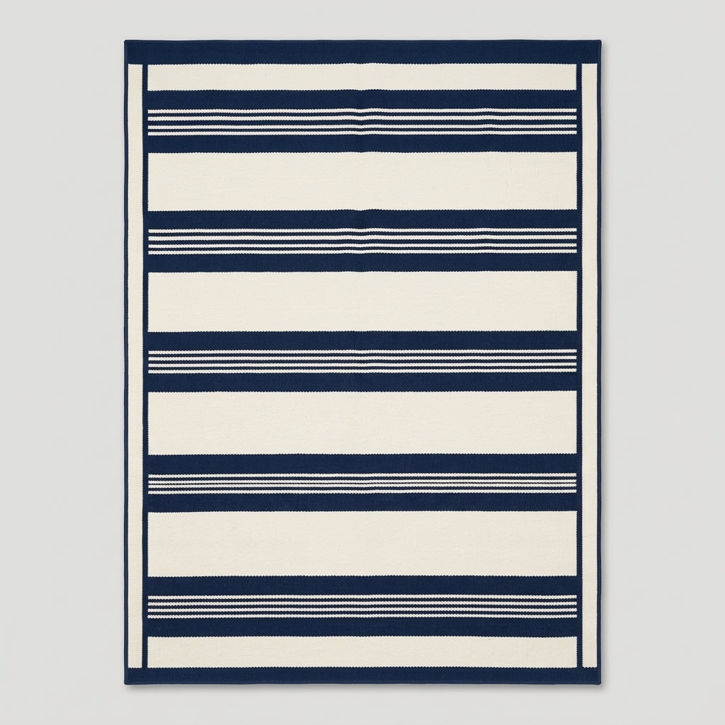 Southwestern Flatweave Wool Rug in navy and ivory, with bold horizontal bands, fine pinstripes, and a slim framed edge.