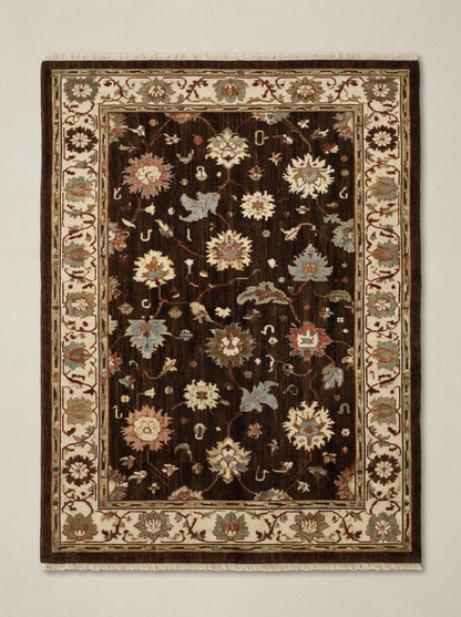Oushak Hand Knotted Rug in chocolate brown wool, with multicolour floral motifs and a wide ivory palmette border.