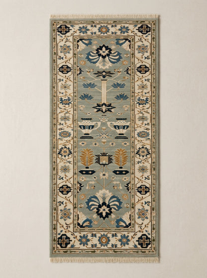 Hand Knotted Oushak Runner Rug in soft blue wool, with ivory floral borders, navy and copper garden motifs, and fringe.