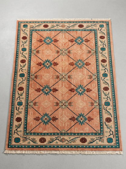 Terracotta Teal Trellis Hand Knotted Wool Area Rug in terracotta wool, with teal and rust star medallions, a diagonal trellis, and an ivory floral border.