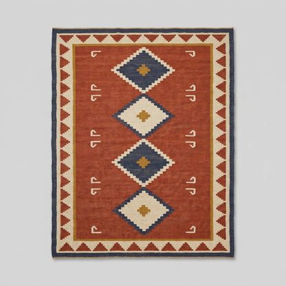 Southwestern Flatweave Wool Rug in rust red with navy, ivory and mustard stepped diamonds, hook motifs and triangle border.